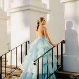 V-neck strapless dress with 5 tiered voluminous tulle skirt with open V back