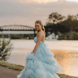 V-neck strapless dress with 5 tiered voluminous tulle skirt with open V back