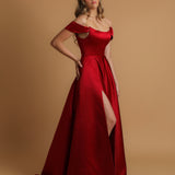 Red satin dress with off the shoulder and high slit