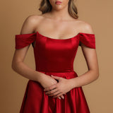 Red satin dress with off the shoulder and high slit